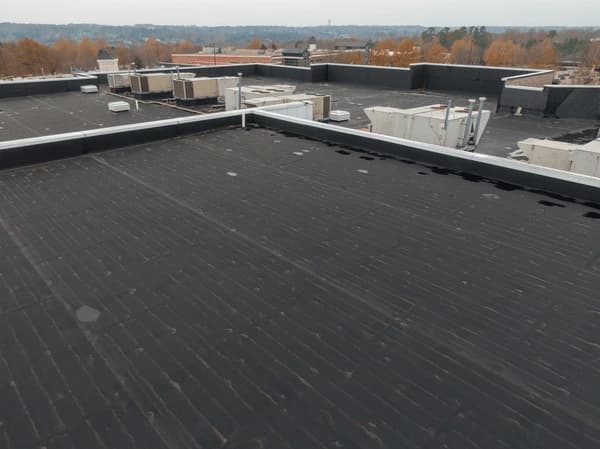 Commercial flat roofing contractor performing repair