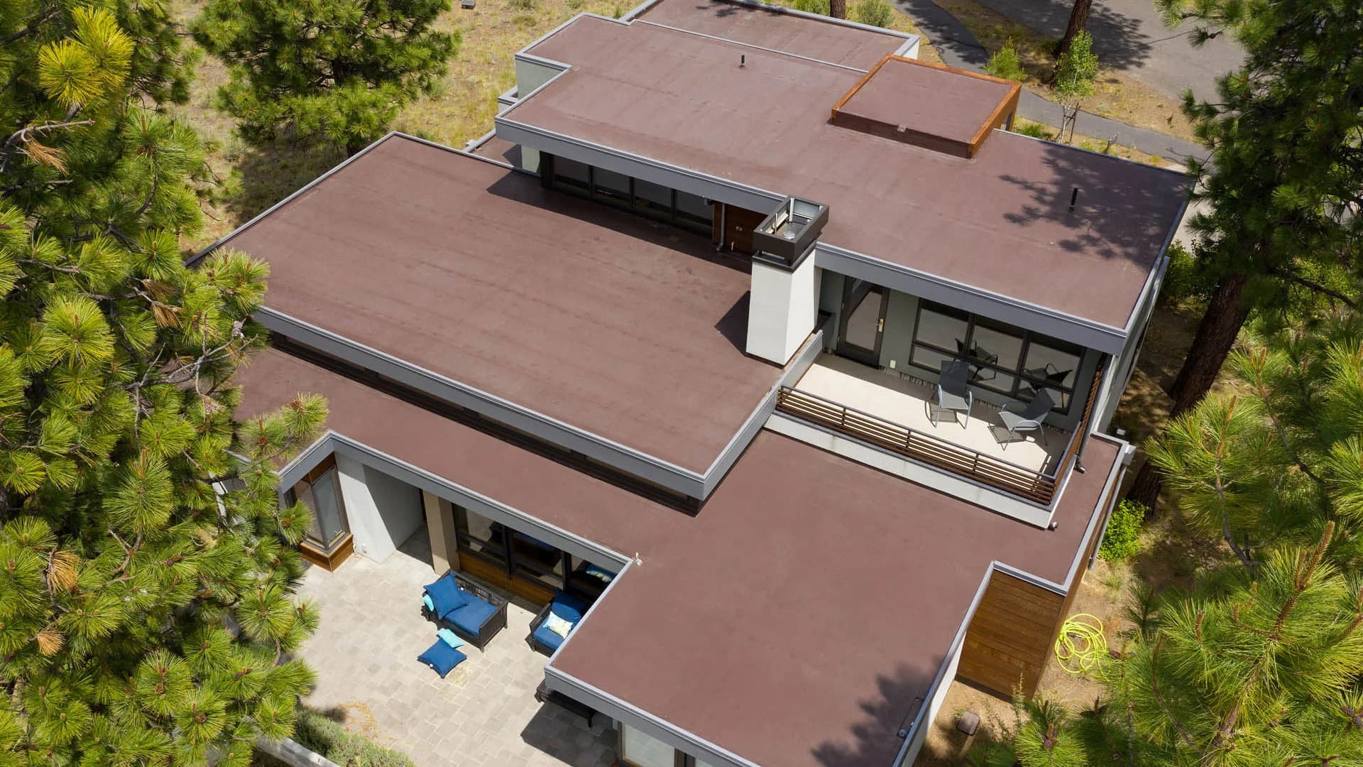 Technician performing flat roof repair
