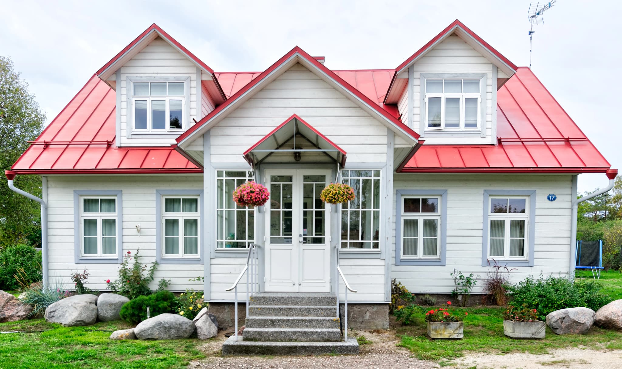 Home with colorful metal roof showing various color options