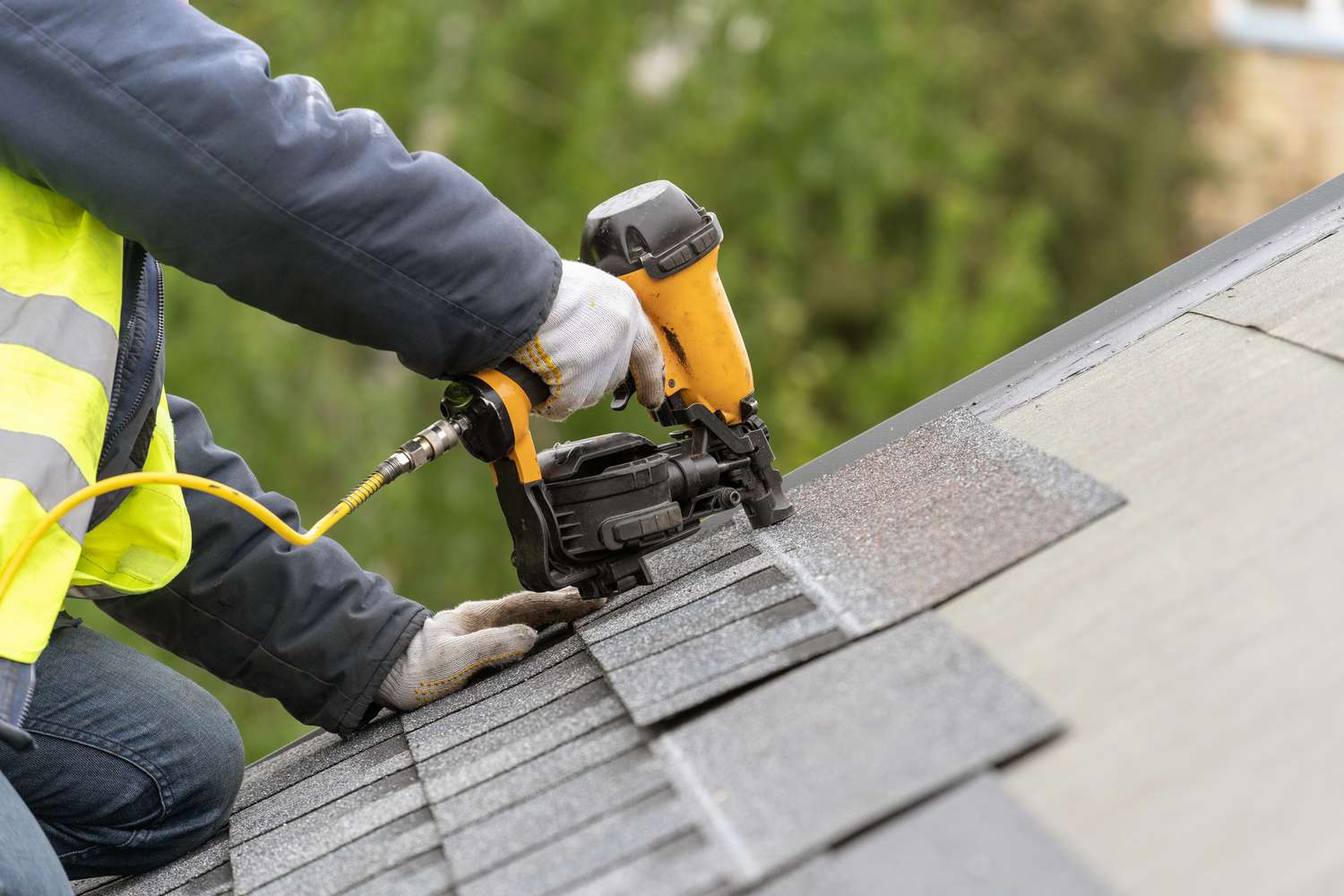 Technician performing roof leak repair