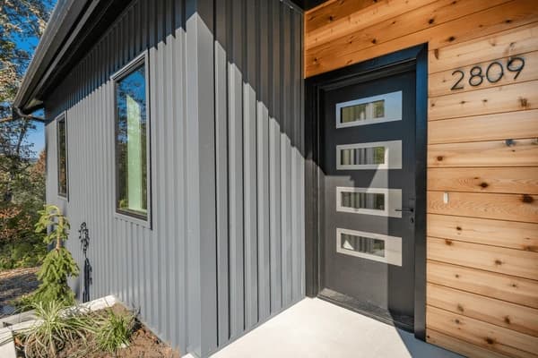 Close-up of cedar siding installation showing natural wood grain and craftsmanship