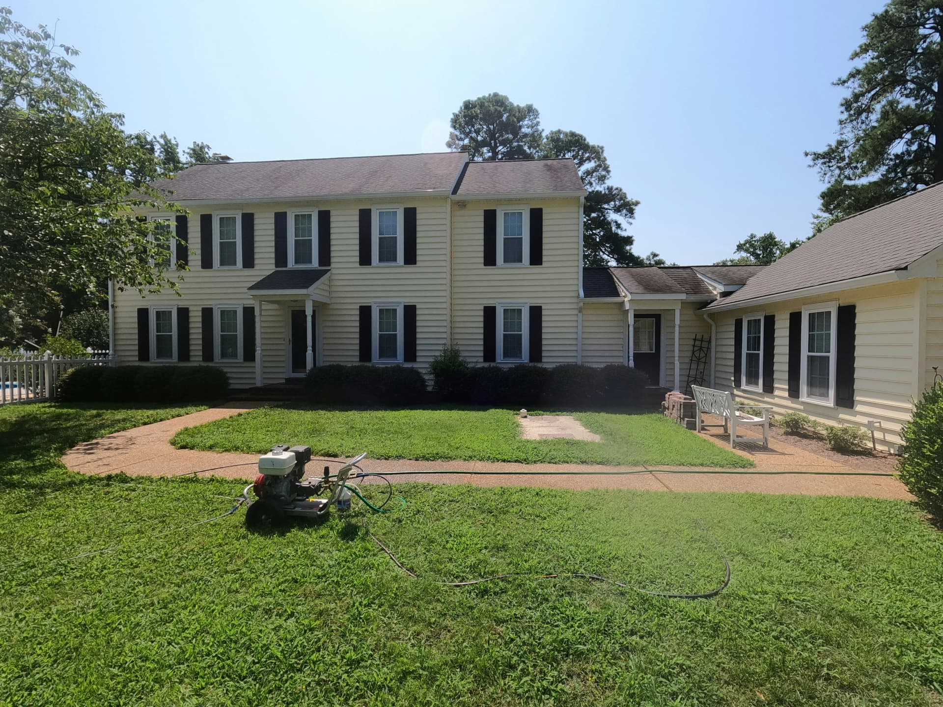 Professional siding installation team working on home exterior