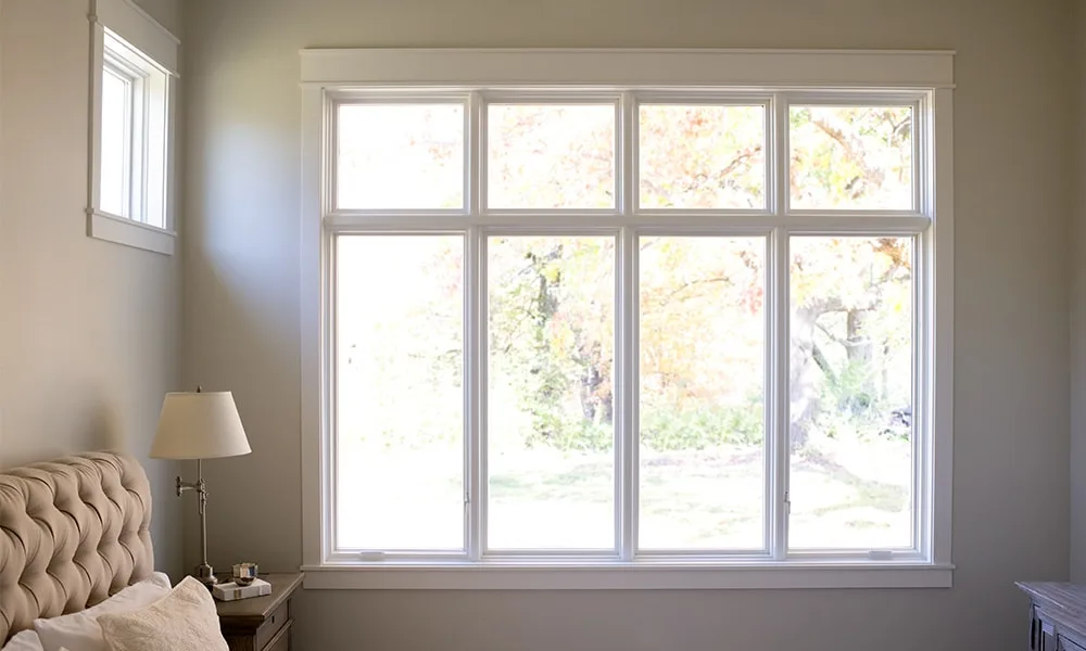 Professional window installation team installing new windows with precision tools
