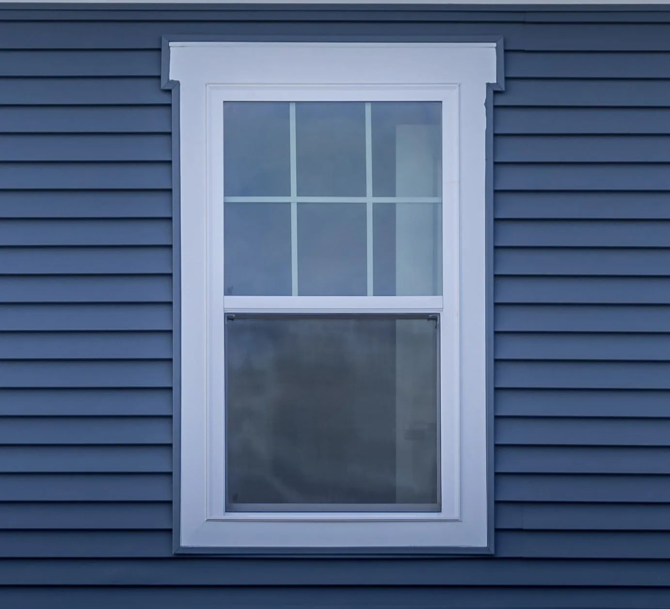Window installation contractor precisely measuring and installing new window