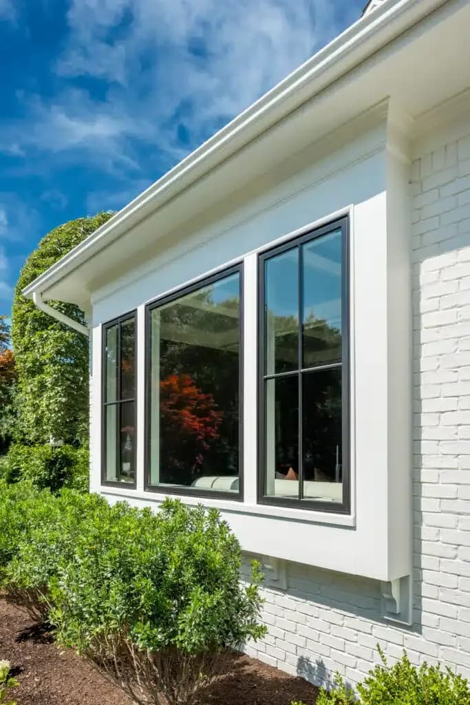 Window installation contractor using precision tools for accurate installation