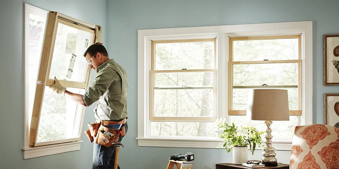 Professional window replacement installation team installing new energy-efficient windows