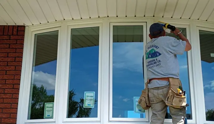 Window replacement contractor installing new vinyl windows